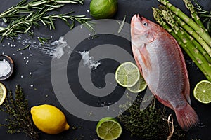 Raw red tilapia fish cooking