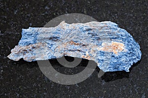 Raw Rhodusite stone on dark background