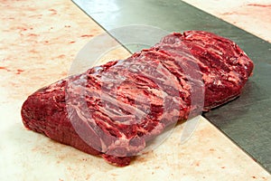 Raw roast beef close up in butchery