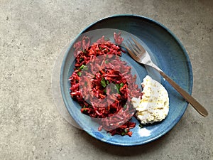 Raw root vegetable salad served with garlic-lemon labneh