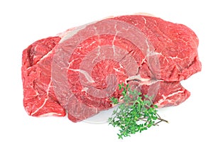 Raw Rump steak with sprig of Thyme