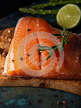 Raw salmon fillet with asparagus and rosemary, wild Atlantic fish