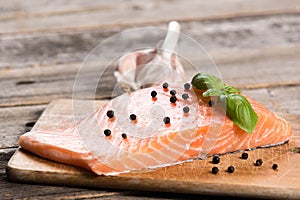 Raw salmon fillet with herbs