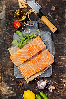 Raw salmon fillet and ingredients for cooking