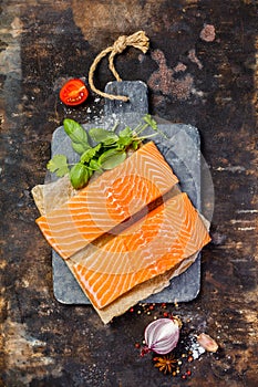 Raw salmon fillet and ingredients for cooking