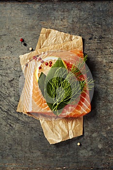 Raw salmon fillet and ingredients for cooking