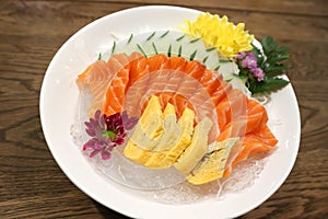 Raw salmon, sashimi or sliced salmon and  egg