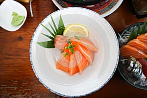 raw salmon, sashimi or sliced salmon or salmon sashimi