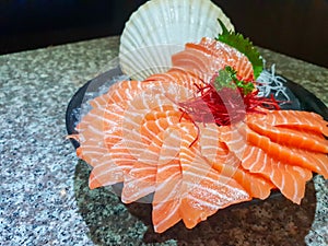 Raw salmon slice or salmon sashimi