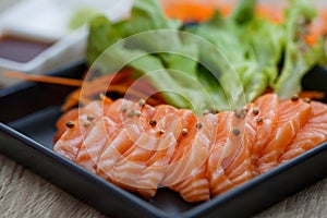 Raw salmon slice or salmon sashimi in Japanese style