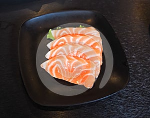 Raw salmon slice or salmon sashimi in Japanese style fresh serve in bowl at Japanese.