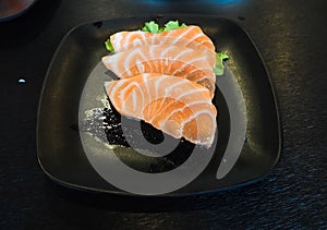 Raw salmon slice or salmon sashimi in Japanese style fresh serve in bowl at Japanese.