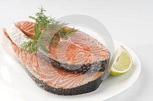 Raw salmon steak with herbs