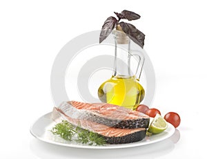 Raw salmon steak with herbs, vegetables