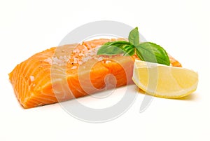 Raw salmon steak with seasoning photo