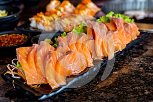 Raw salmons fillet on dish with wasabi in restaurant,Japanese food style photo