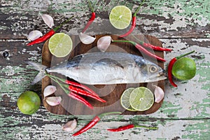 Raw salt mackerel fish with vegetables