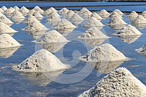 Raw salt or pile of salt from sea water in evaporation; ponds at