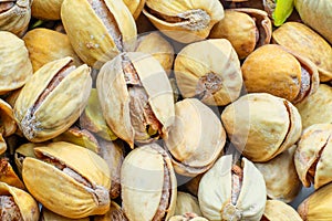 Raw salted pistachios nuts, top down view. Macro shot, perfect for vegan diet and healthy eating