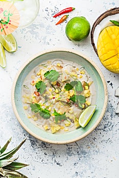 Raw scallops appetizer with tropical fruits, whaite background