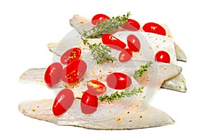 Raw sea bass fillets with cherry tomatoes on white