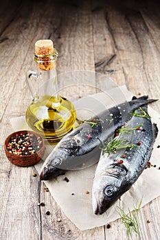 Raw seabass fish on the wooden board