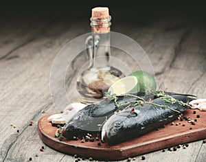 Raw seabass fish on the wooden board