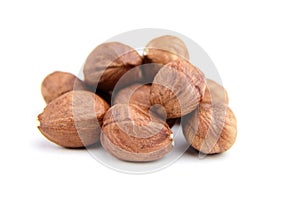 Raw shelled hezelnuts or filberts isolated on white