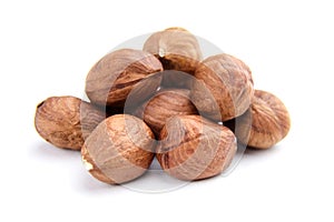 Raw shelled hezelnuts or filberts isolated on white