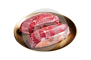 Raw Shoulder Top Blade beef meat steaks on a plate. Isolated on white background. Top view.