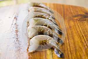 Raw shrimps on the wooden board