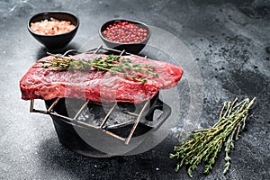 Raw Sirloin steak, beef meat. Dark Wooden background. Top view