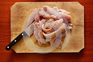 Raw skinless chicken breast fillets