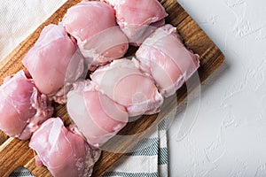 Raw skinless  chicken meat on white background, flat lay with copy space