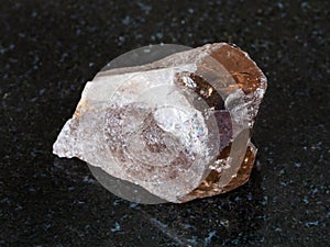 raw smoky quartz crystal on black