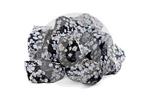 Raw snowflake obsidian stones on white background