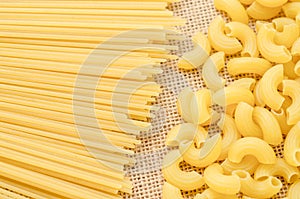 Raw Spaghetti and elbow macaroni.