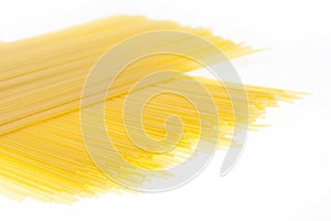 Raw spaghetti pasta on the witel background