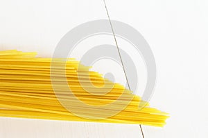Raw spaghetti on a white background photo