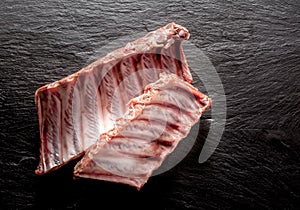 Raw Spare Ribs on Textured Grey Background