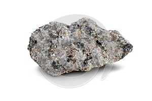 Raw specimen of granite igneous rock isolated on a white background.