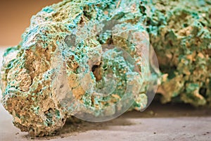 Raw specimen of Malachite stone from mining and quarrying industries. Malachite is a copper carbonate hydroxide mineral, with