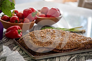 Raw Spiced Rubbed Beef Brisket on marble kitchen counter photo
