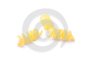 Raw spiral pasta isolated on a white