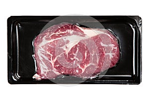 Raw steak in an airtight packaging