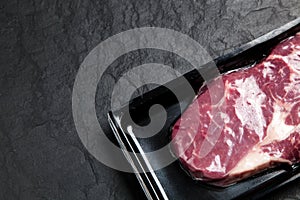 Raw steak in an airtight packaging