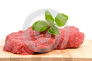 Raw steak on cutting board