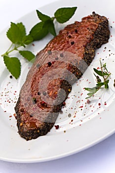 Raw Steak , marinated , with mint