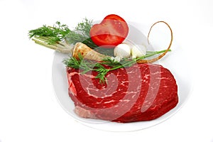 Raw steak and vegetables