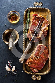 Raw steaks Ribeye, spices and herbs